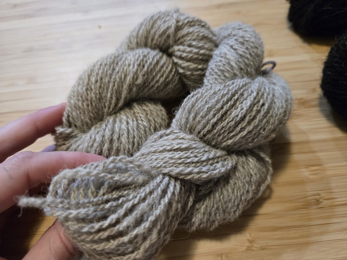 a skein of light grey handspun yarn
