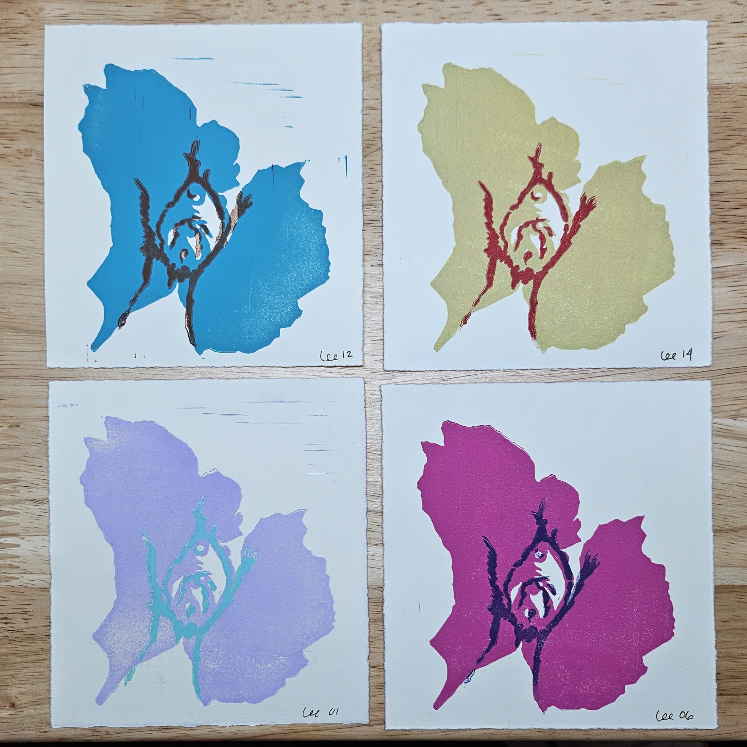 4 copies of the same print in various color schemes, laid out in a 2x2 grid. The print shows testosterone-driven bottom growth of a clitoris. The color schemes are, clockwise from top right, brown on turquoise, red on cornsilk (muted yellow), violet on magenta, and mint green on lilac.