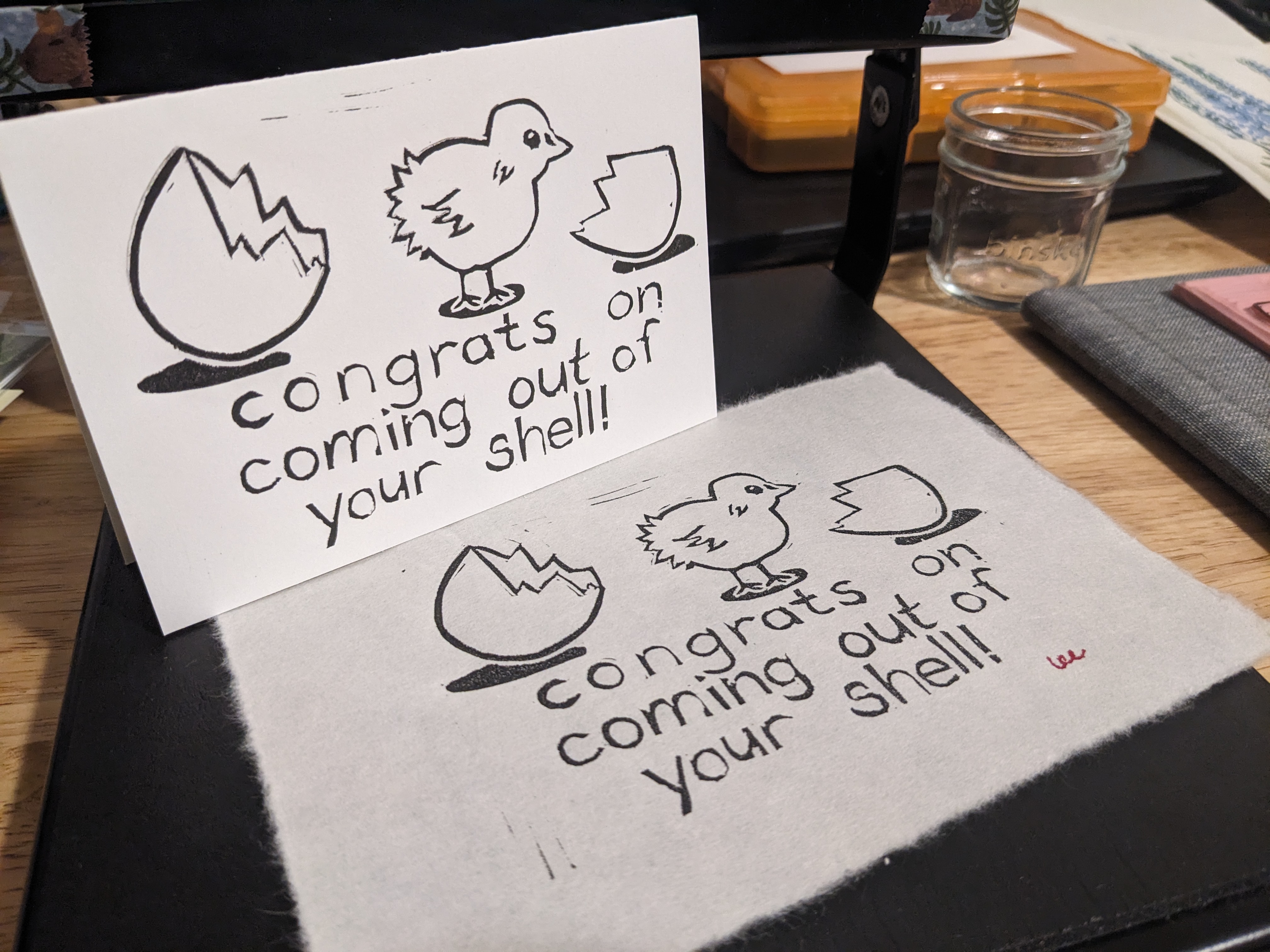 A card and print in the same design - a chick and a broken eggshell, and a simple font reading 'congrats on coming out of your shell'