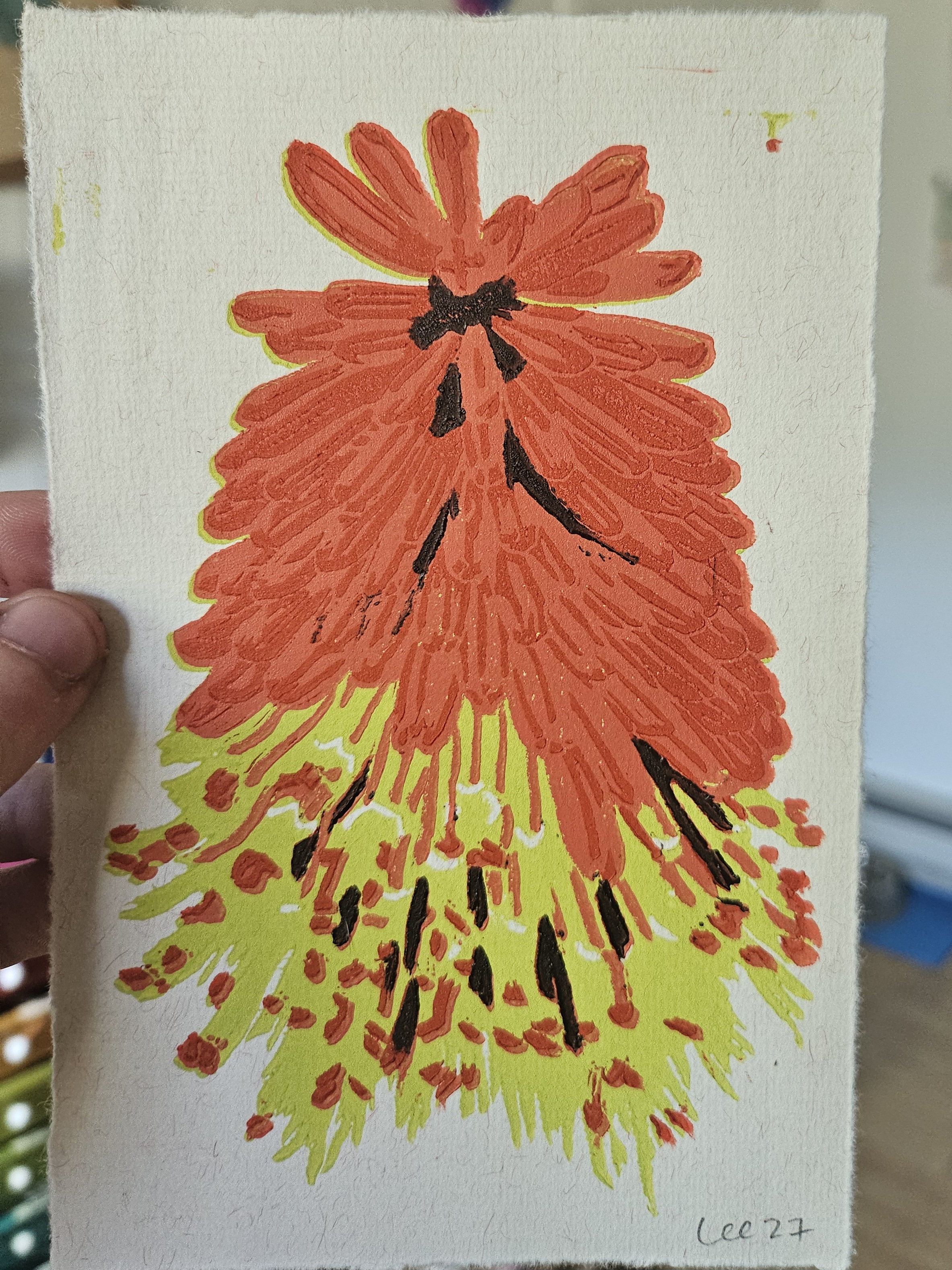 A print of a brightly colored flower in 4 layers of color