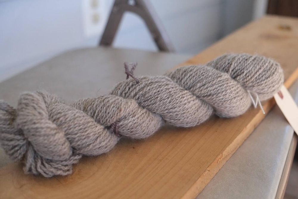 a skein of light grey handspun yarn